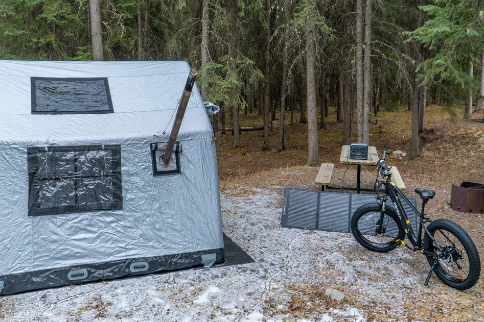 Blogger testing a foldable solar panel in a backyard setting